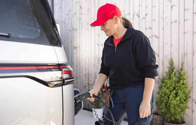 Employee charging car at home