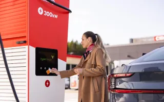 woman tapping her Circle K card to pay for charging her car